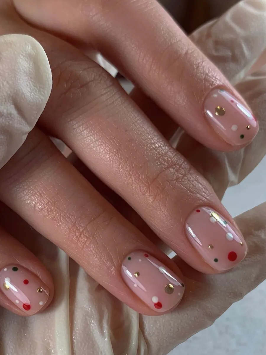 Minimal dot garland nail art on nude nails